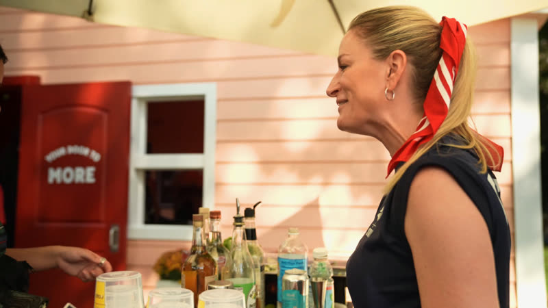 A guest laughing at a branded festival activation